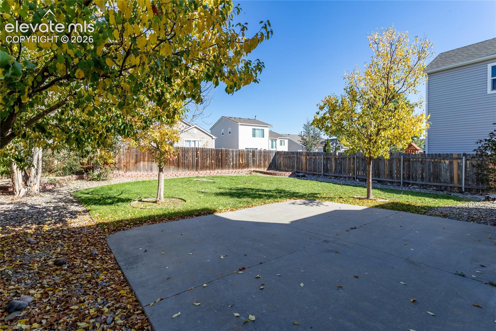 Enjoy outdoor gatherings and summer barbecues on the large concrete patio surrounded by lush lawndirectly to the patio and private backyard setting