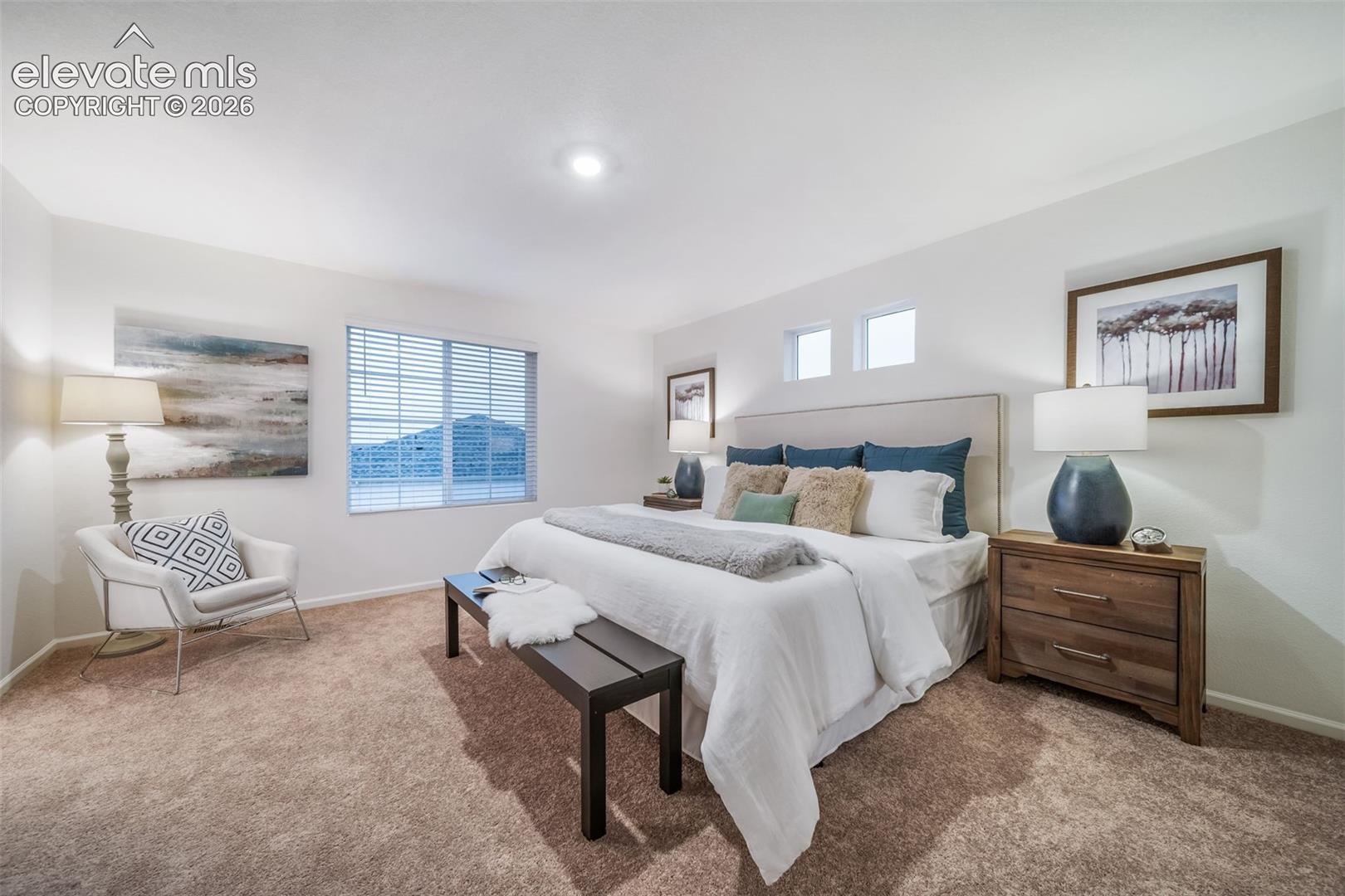 Wall-to-wall carpeting with an upholstered headboard, multiple windows, and recessed lighting
*photos of a model home*