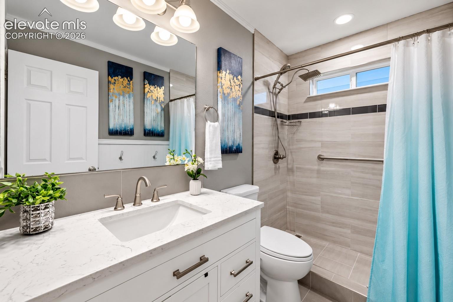 Fresh finishes and a beautifully updated shower give this bath a crisp, contemporary look.