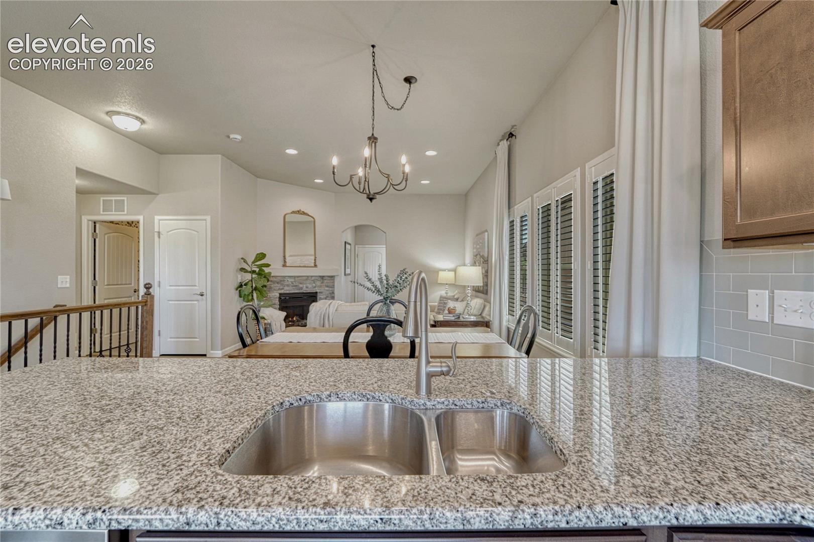 The kitchen opens seamlessly to the dining and living room areas, creating an ideal layout for everyday living with generous counter space and quality finishes.