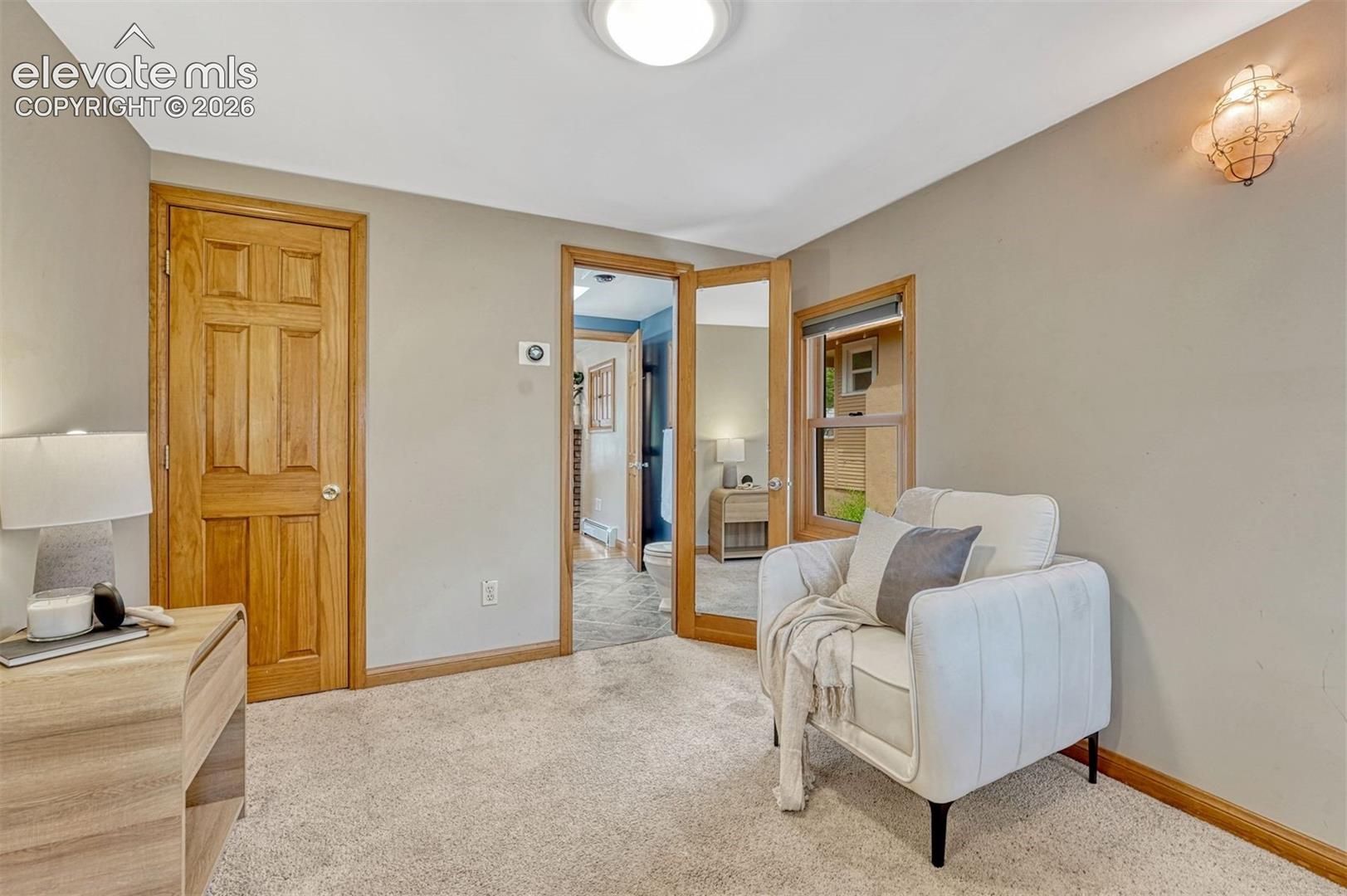 Main bedroom features sitting area and adjoining bathroom