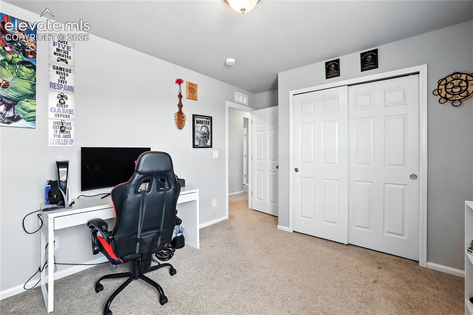 Wall-to-wall carpeting with light gray walls and white trim