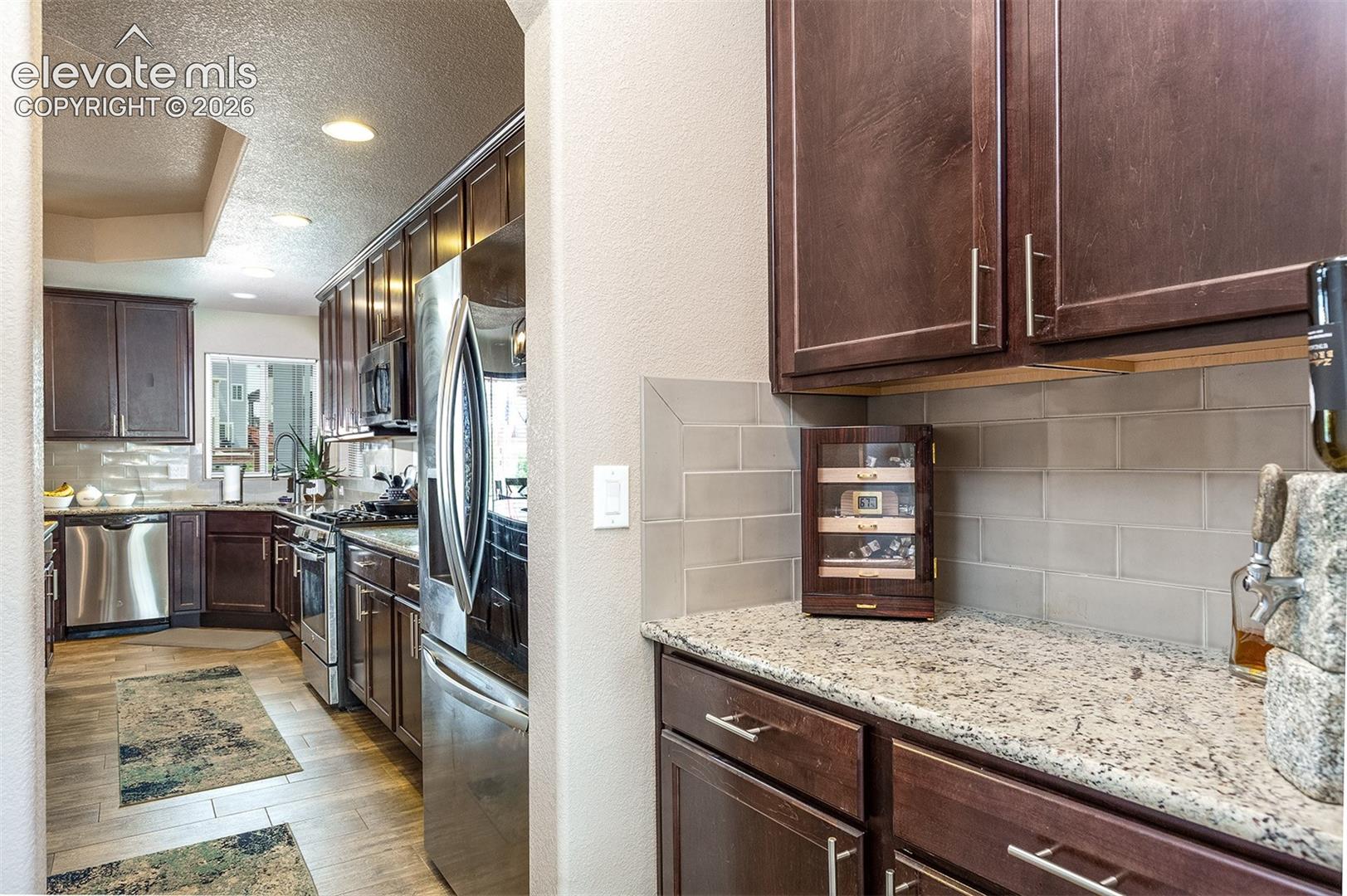 A walk-in butler's pantry is conveniently located between the formal dining room and kitchen