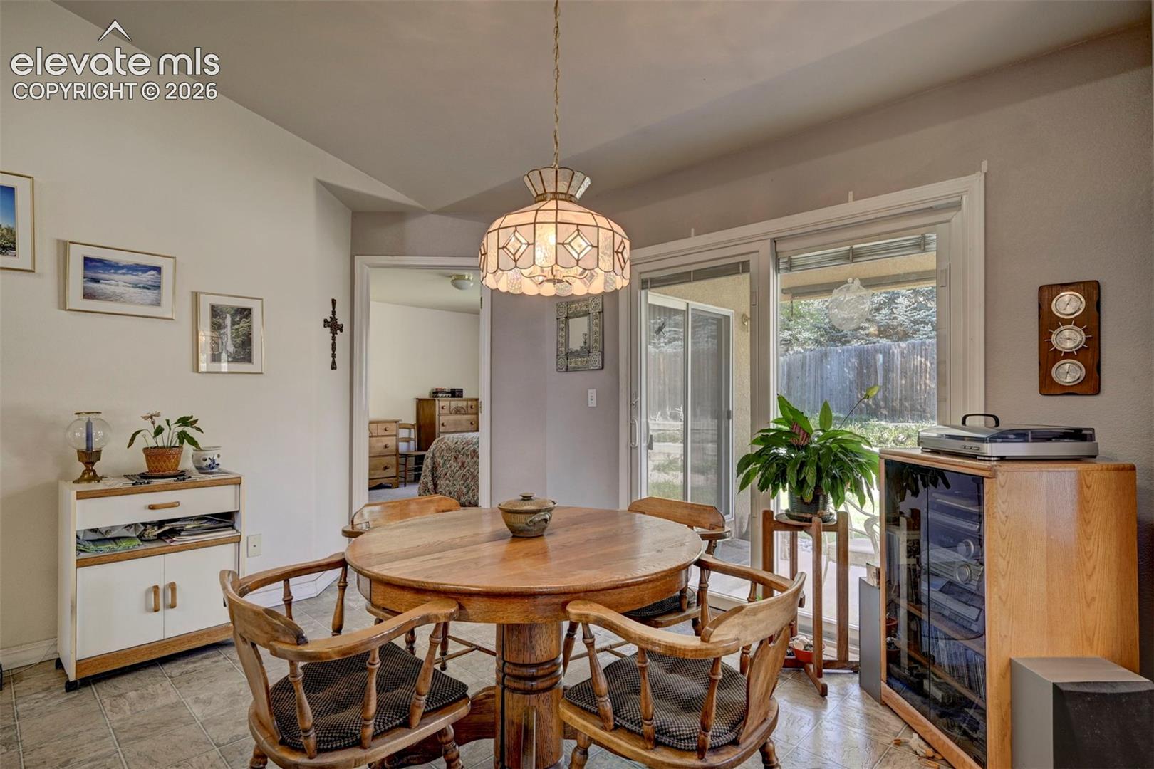 Dining area with slider leading to backyard and patio area.