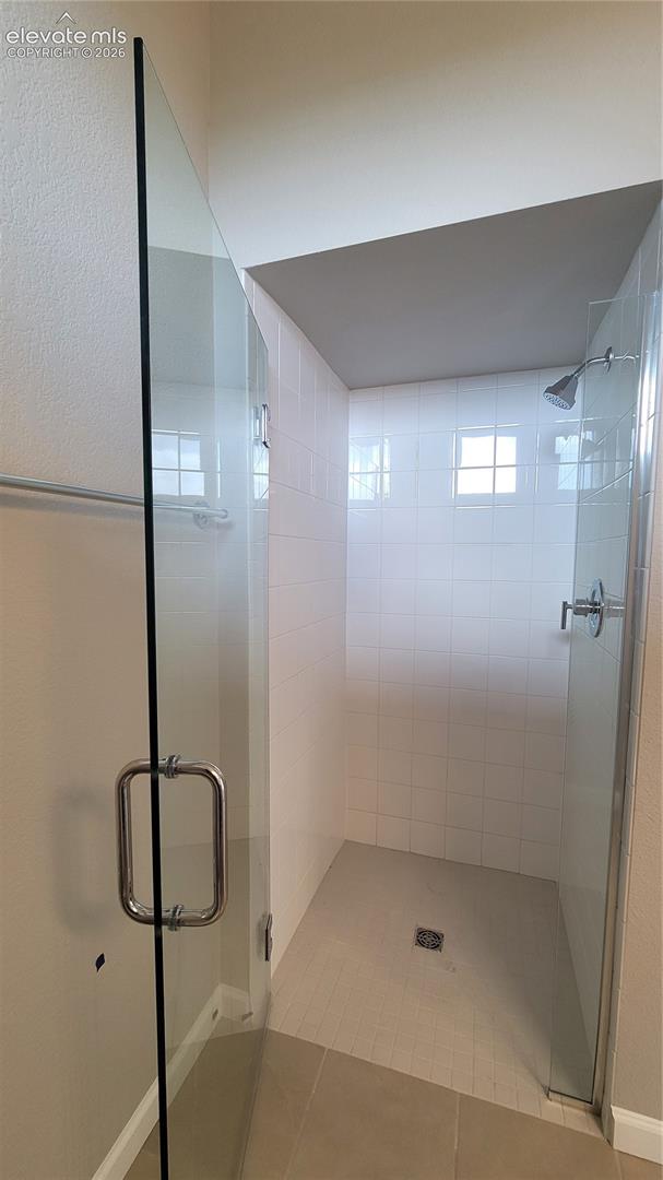 Zero entry shower with tile surround at Junior suite bathroom! 