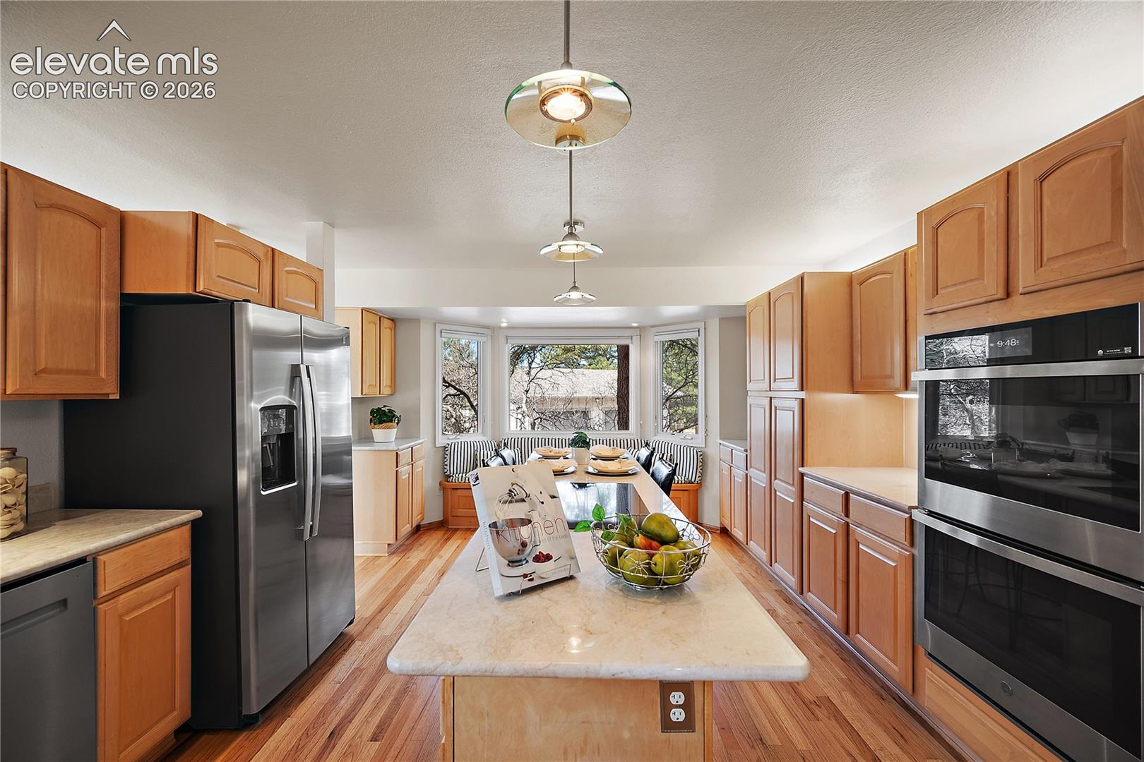Double oven, large island with cooktop. 