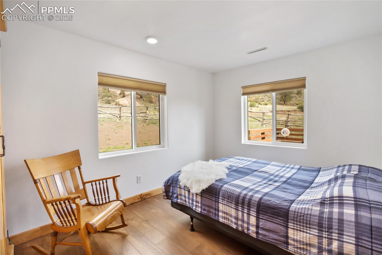 Bedroom 3 of 3, with two big windows.