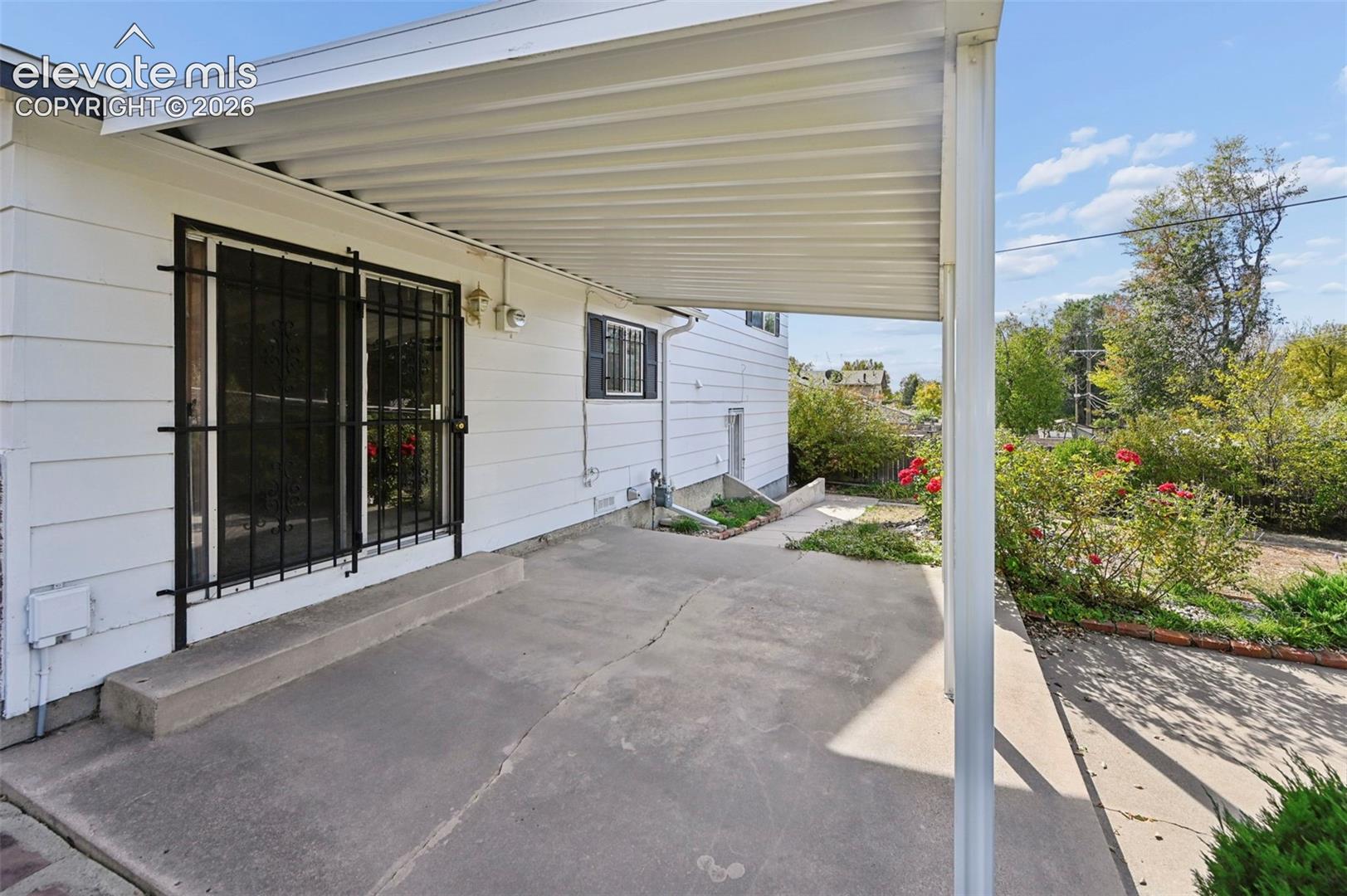 Spacious covered concrete patio  