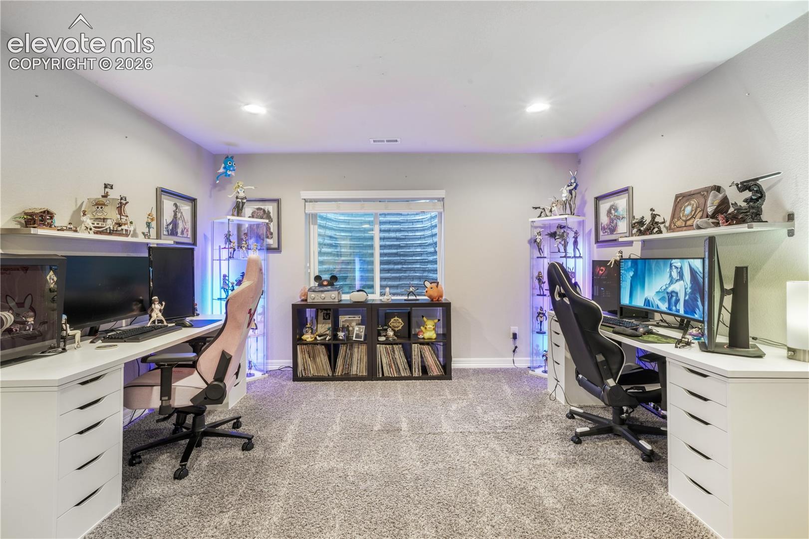 Recessed lighting illumination, wall-to-wall carpeting, window with privacy blind, built-in shelving, and floating wall shelves
