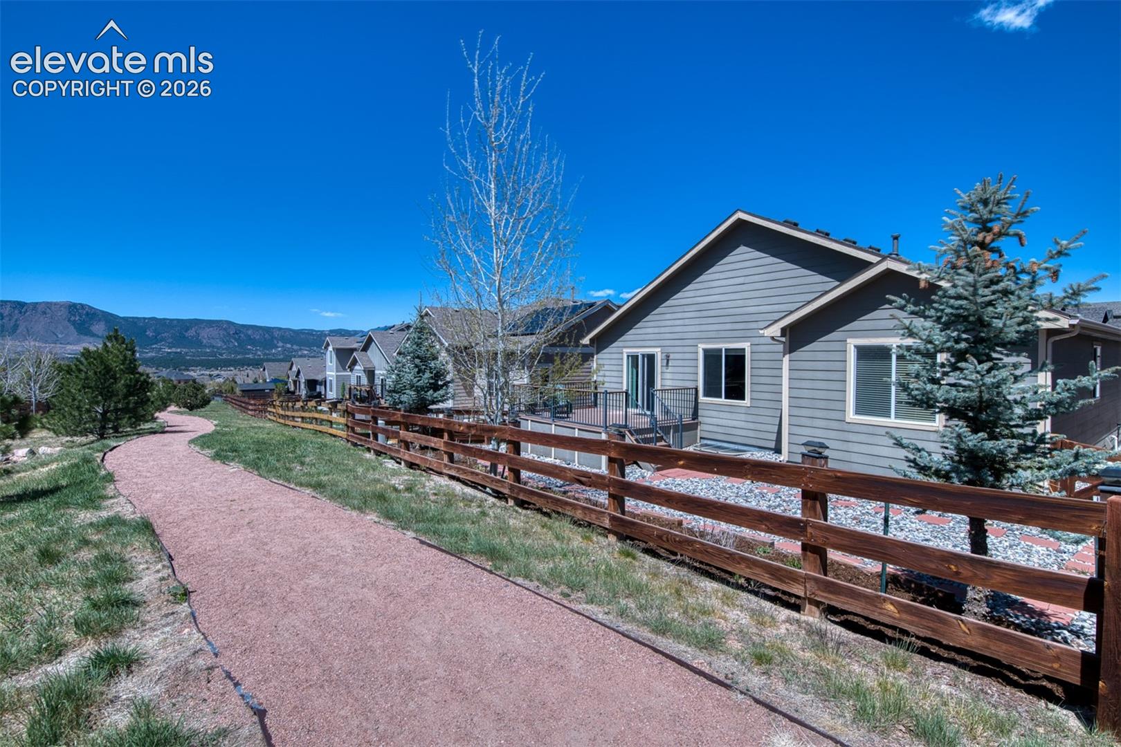 Neighborhood walking trail to play park behind property