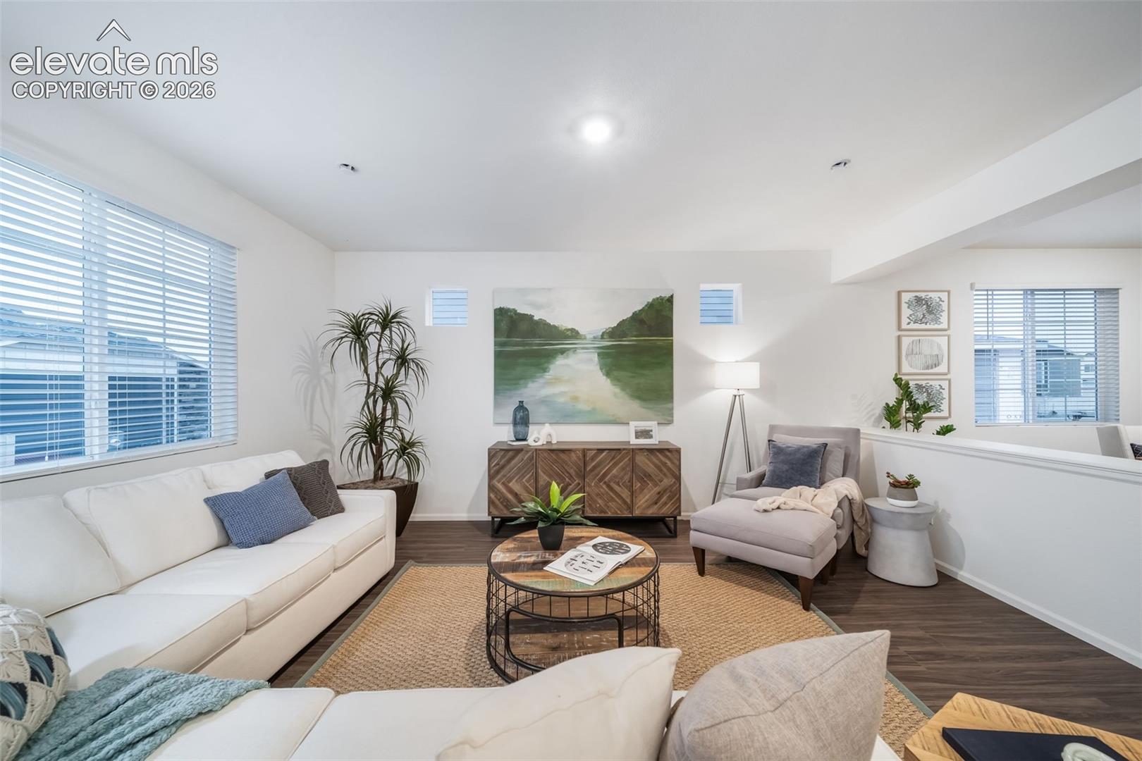 Recessed ceiling lighting, wood-finish flooring, white walls, and multiple windows with blinds
*photos of a model home*