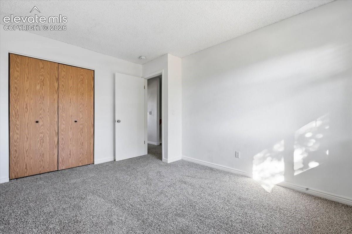 Light grey textured carpeting