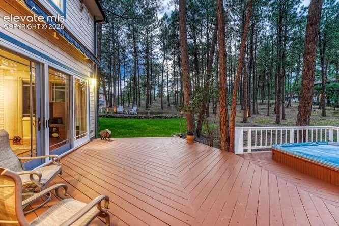 deck with built in 8 person hot tub, retractable awning