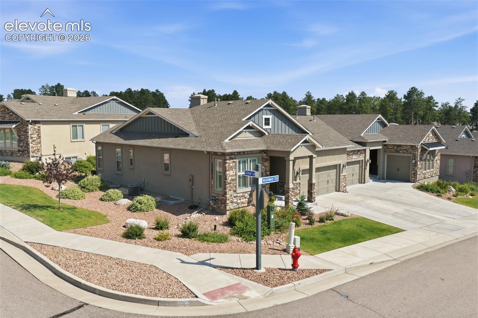 Contemporary stucco and stone exterior.