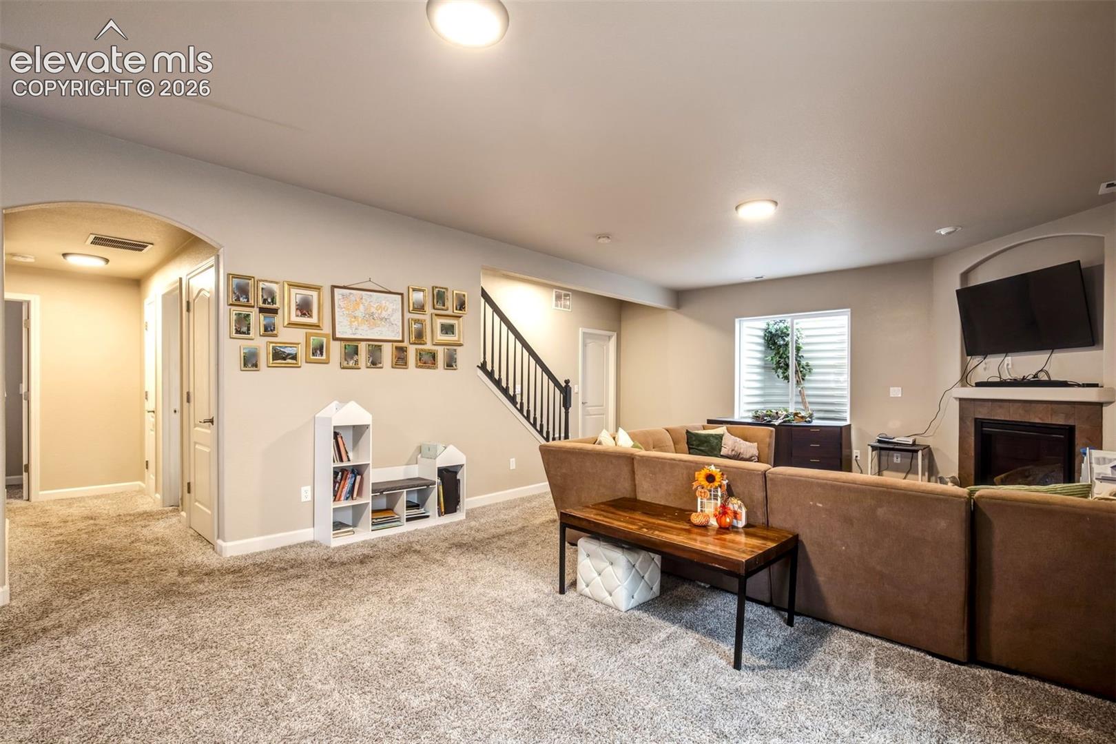 Large basement rec room with fireplace 