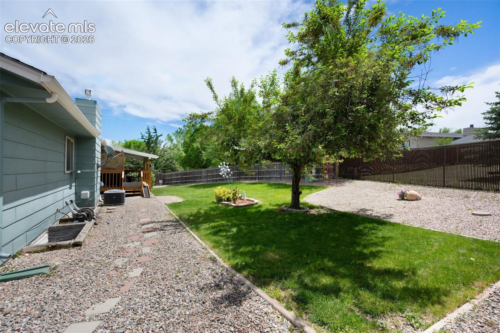 View of yard with a patio and cooling unit