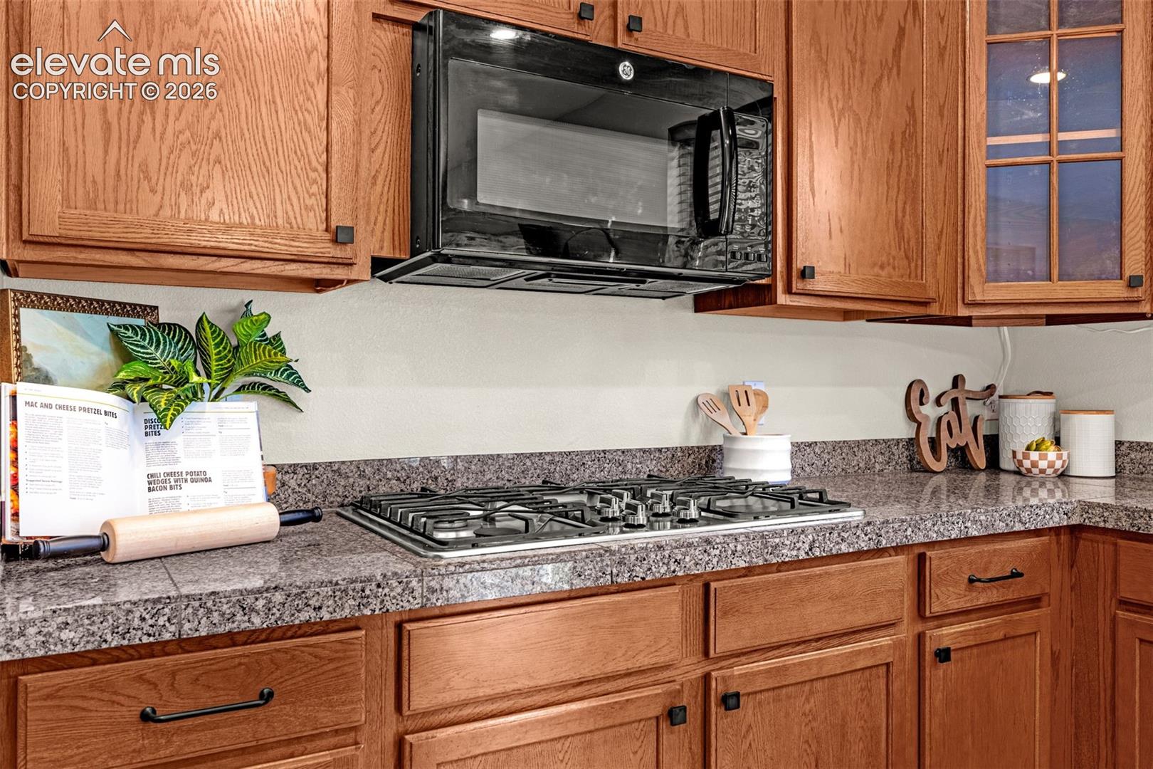 Gas cooktop and overhead microwave