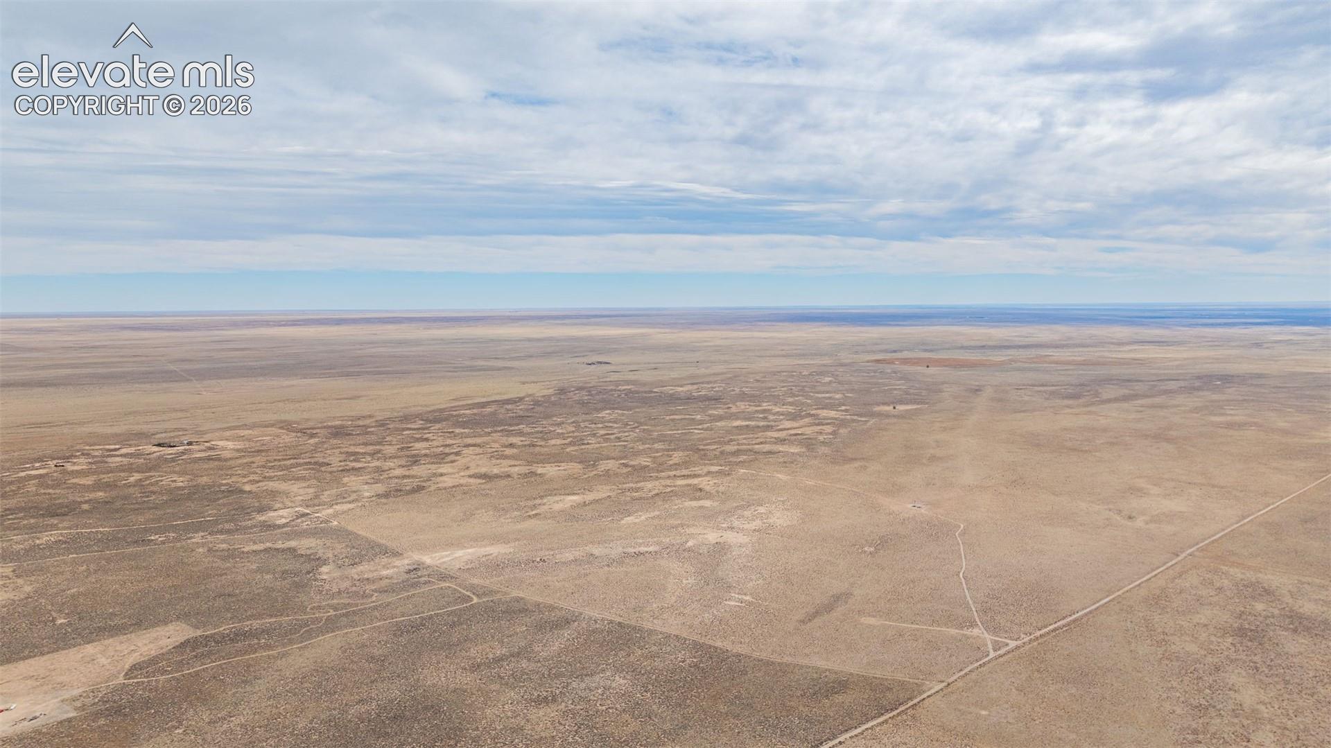 Expansive acreage characterized by vast, open plains and natural terrain