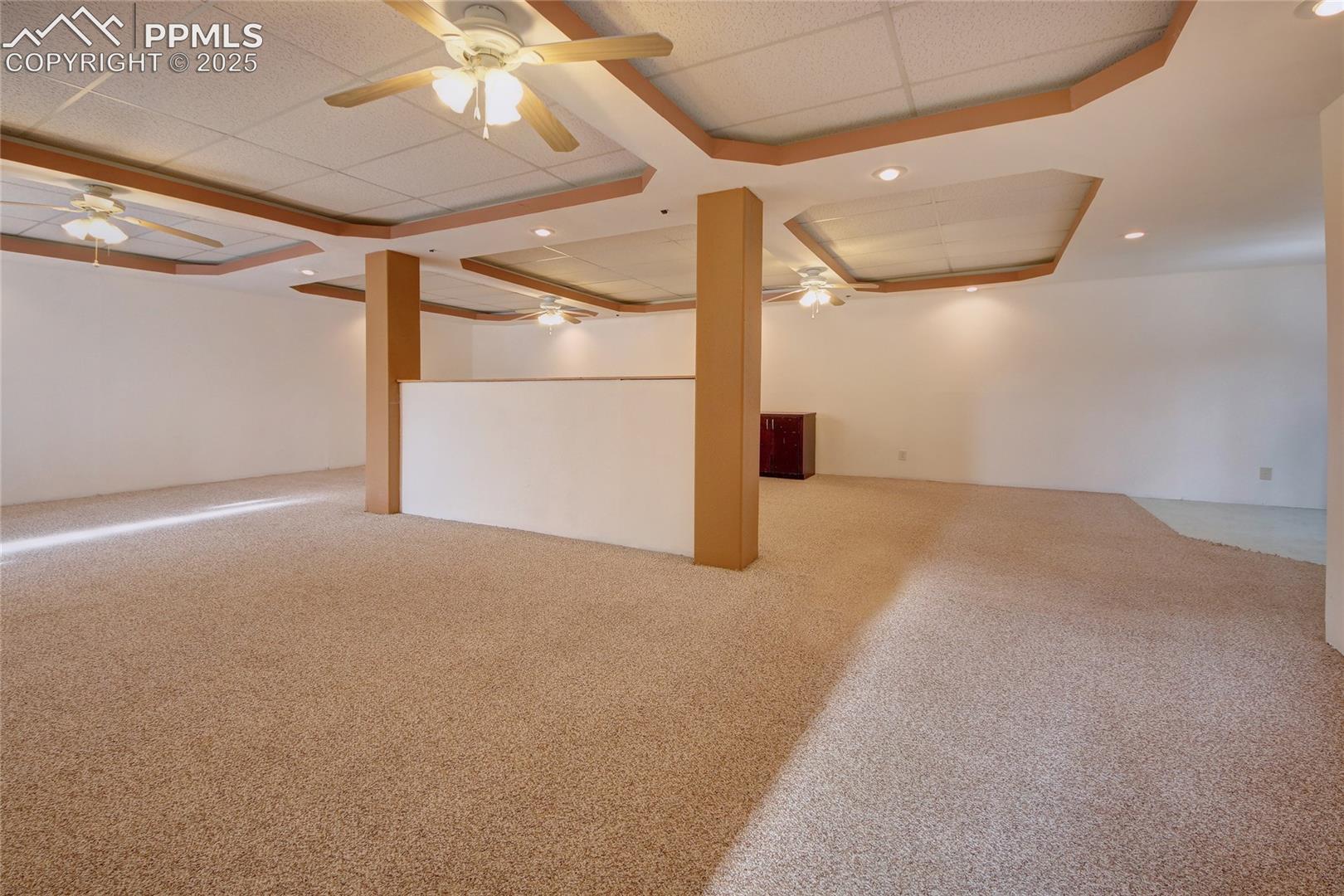 Family room offers lots of ceiling fans and lights