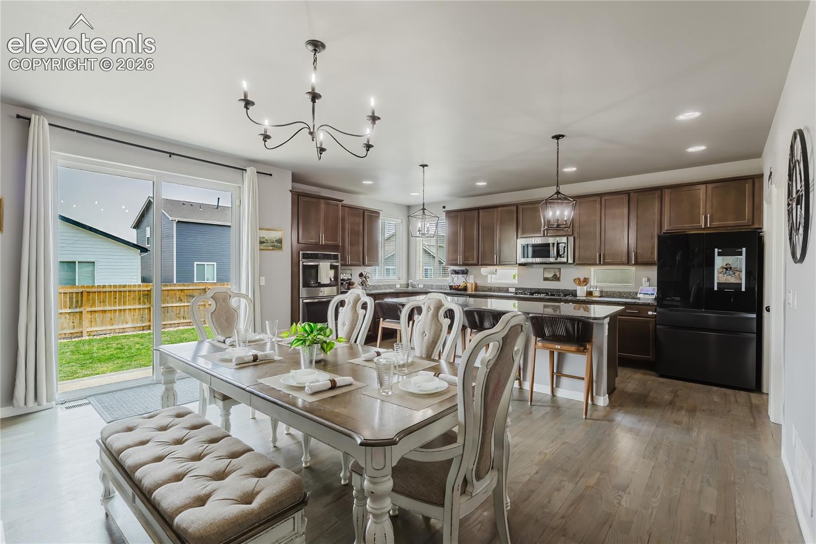 Open-concept living space featuring wood-finish flooring