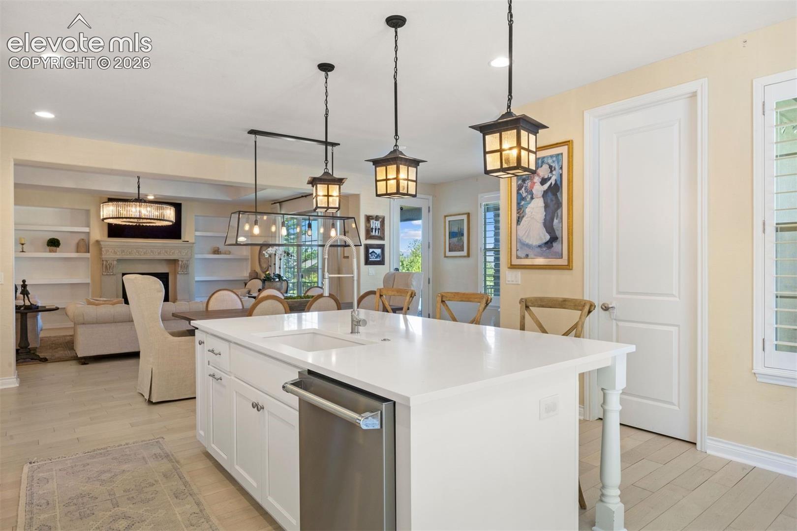 Kitchen island with white countertop and integrated sink