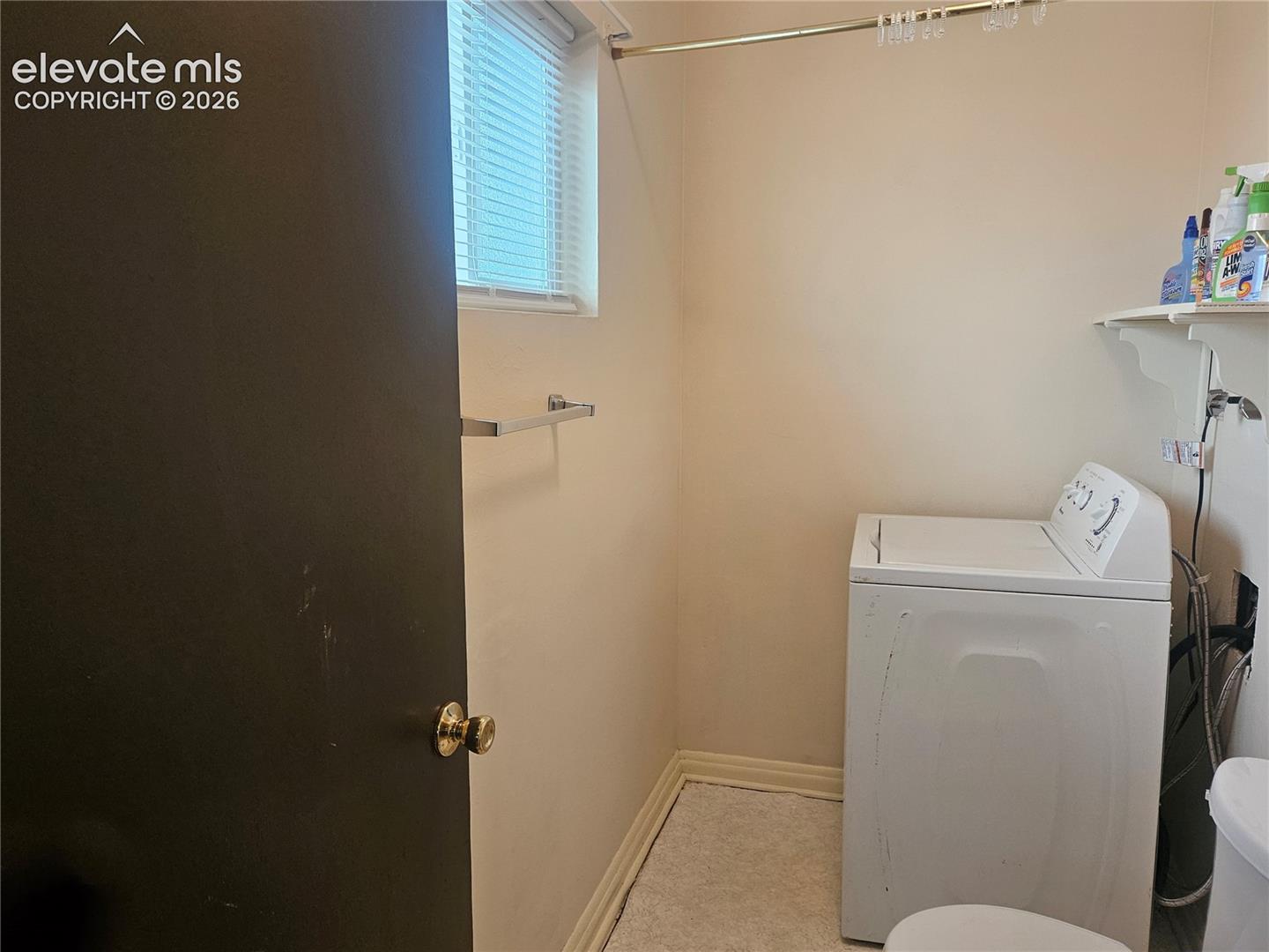 1/2 Bath, out of the Bonus Room.  Clothes washer