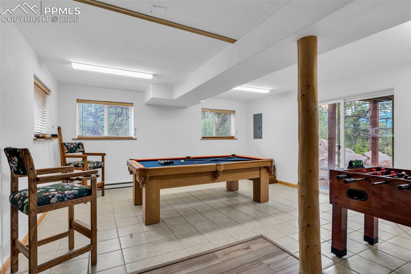 Separate game room with walkout to backyard and mountain views