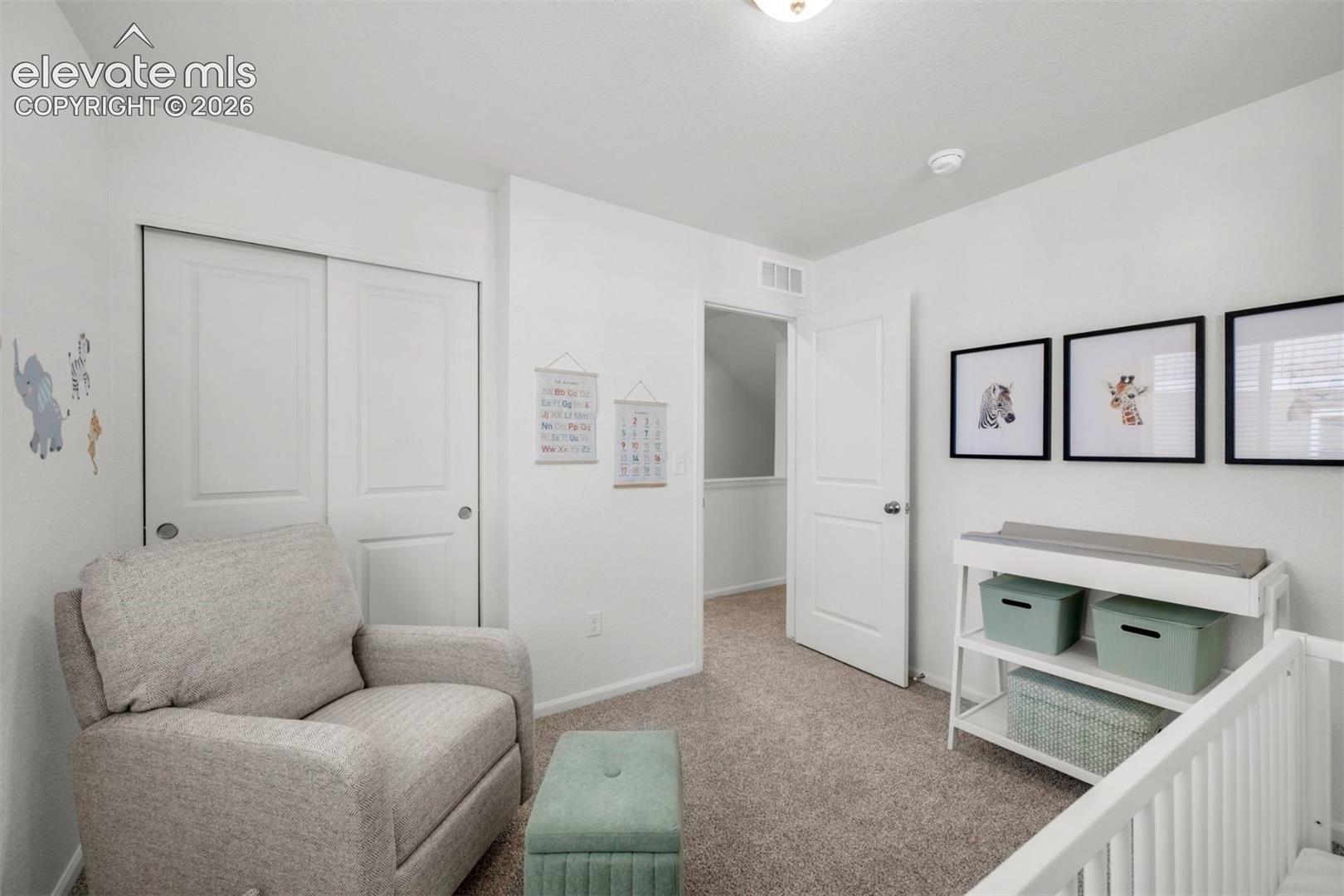 Wall-to-wall carpeting, white interior doors, and a built-in closet with sliding doors
*photos of a model home*