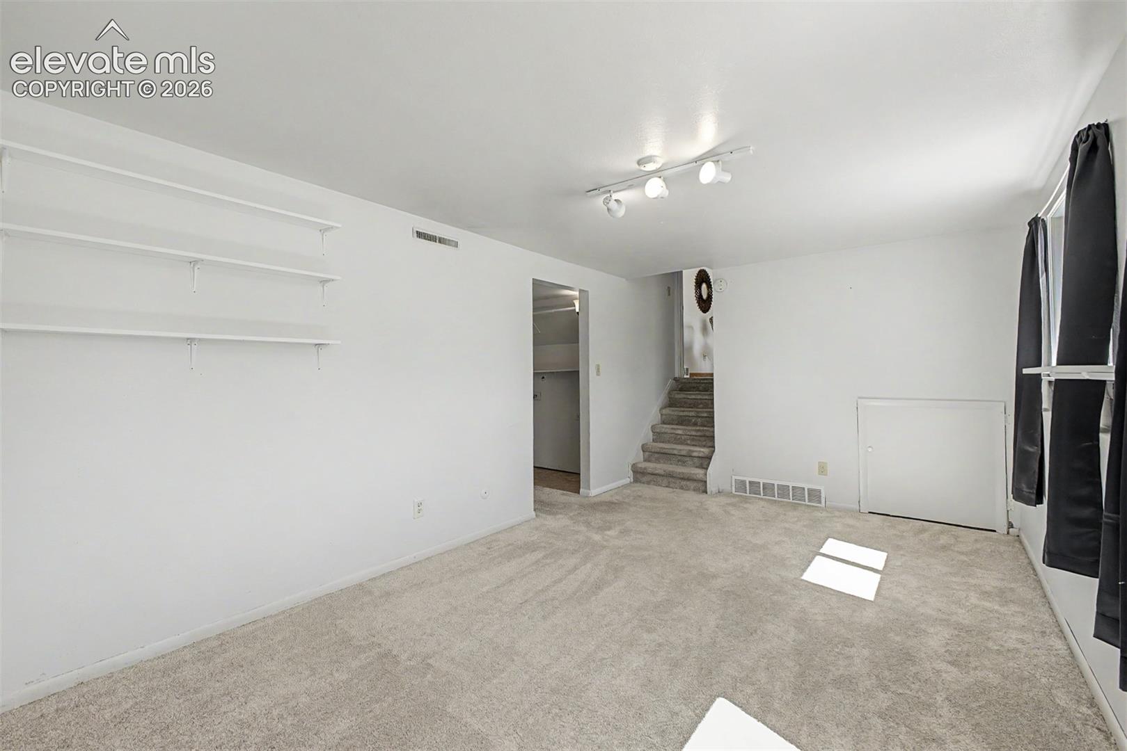 Lower level room offers lots of flexibility as a recreation room, office or another living area. 