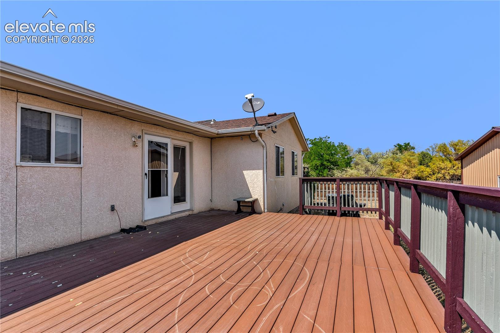 Expansive outdoor deck with composite decking and full railing