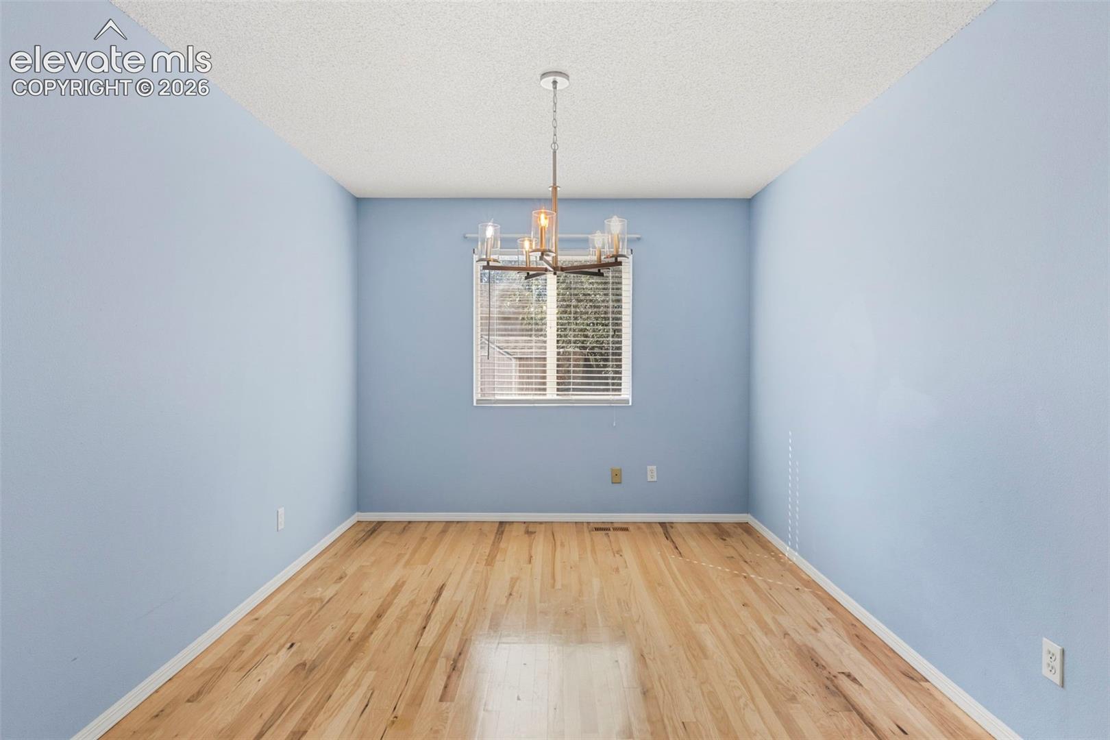 Separate dining room w/ updated light fixture