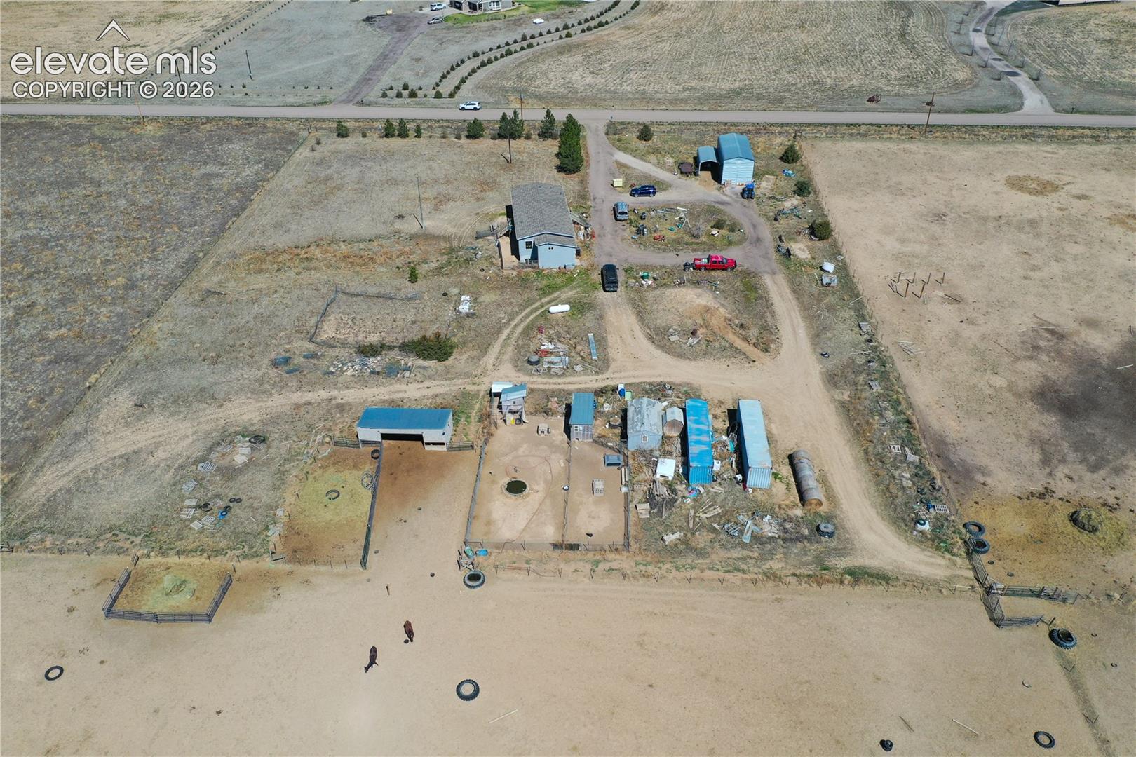 Aerial view of property and surrounding area featuring rural landscape