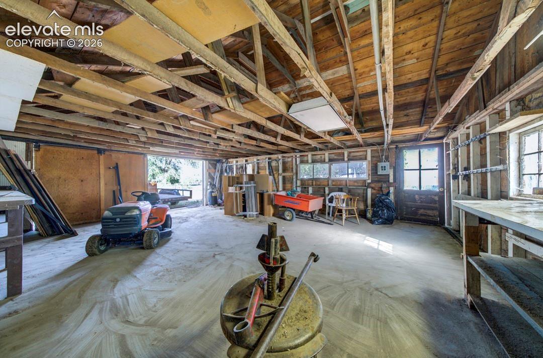 Detached two-car garage with built-in tire repair stand