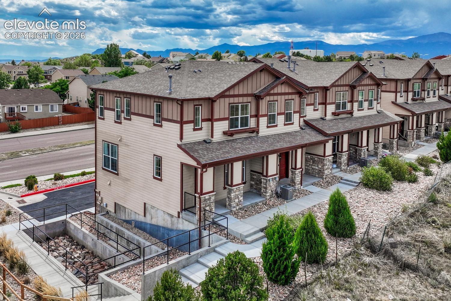 Aerial front view of building that has open space views.