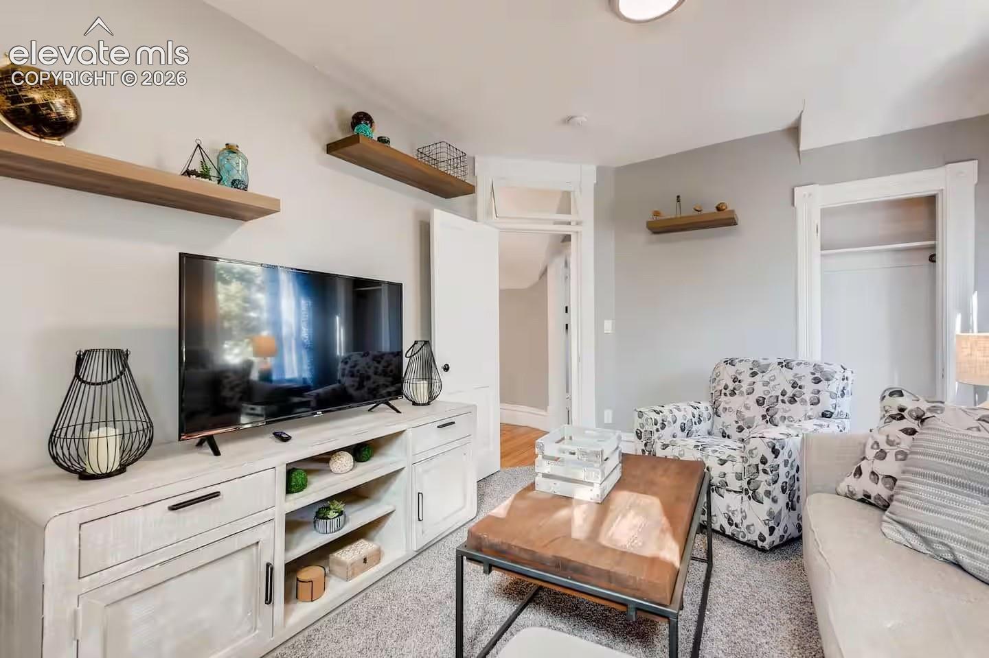 Second floor living room could also be a 5th bedroom with closet and windows and lots of light.