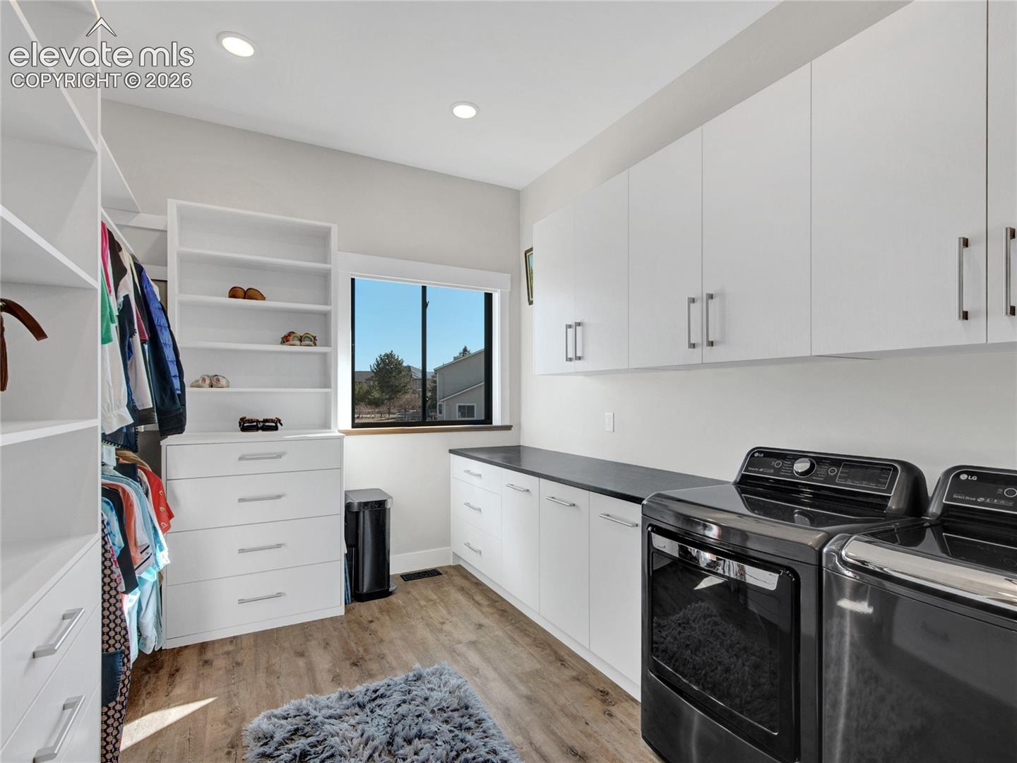 Primary closet with laundry