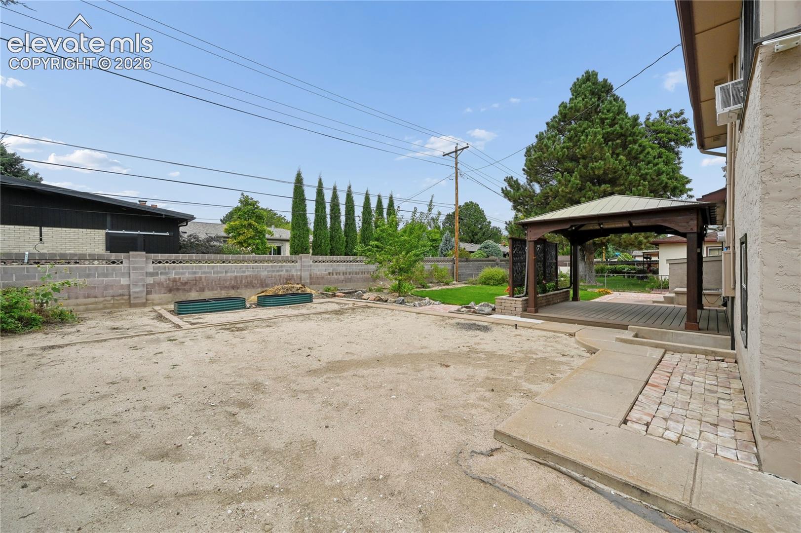 Backyard with Space for Parking or Your Next Project!