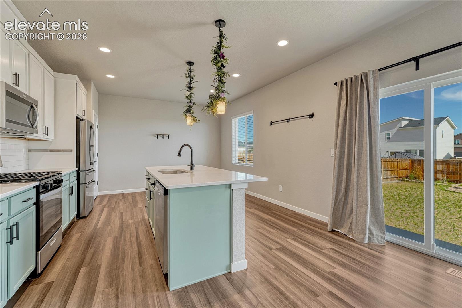 Note the 2-tone cabinetry and luxury vinyl flooring. 