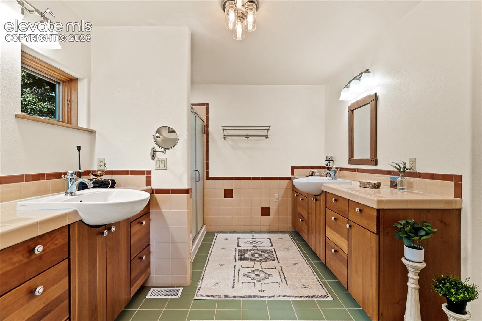 Primary bathroom photographed June 2026