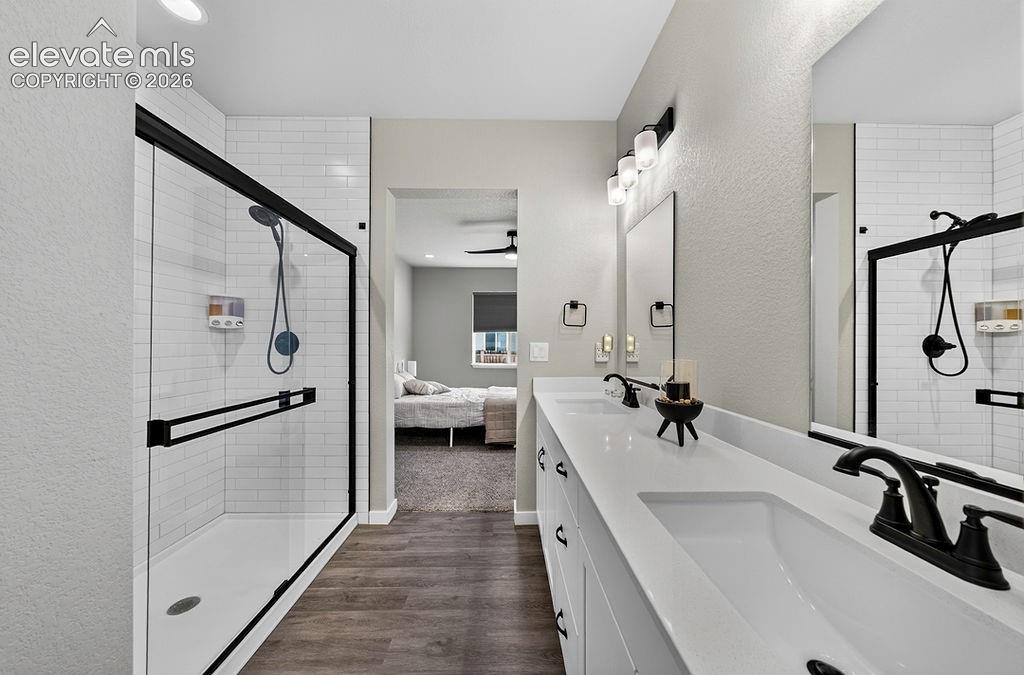 Double vanity with integrated sinks and white countertops