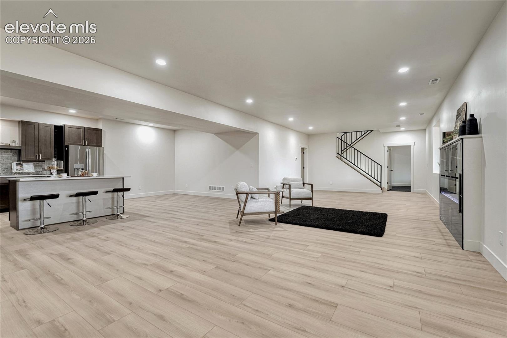 ...and 2 above-grade windows. Open concept with kitchen, great room and dining area. 