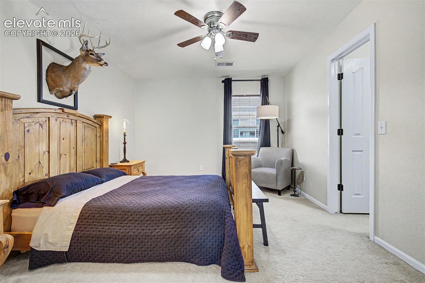 A generously sized fourth bedroom with ceiling fan, large window, and plush carpet offers endless flexibility — guest room, home office, hobby space, or all of the above.
