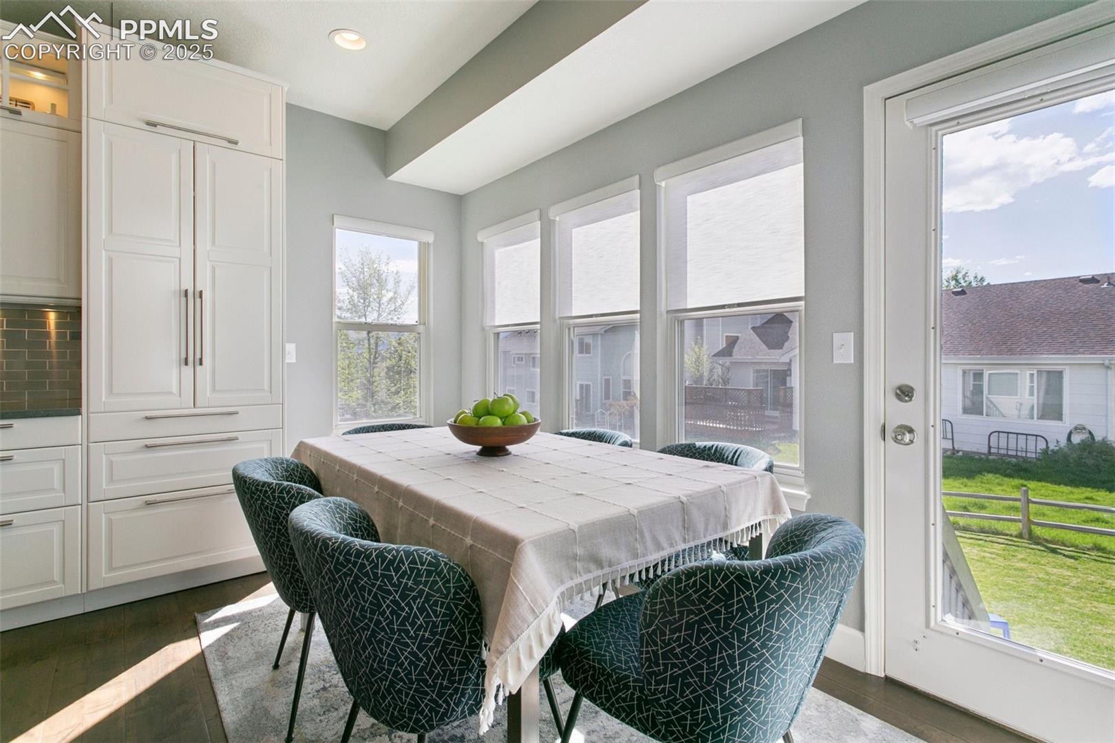 Casual dining nook overlooking the backyard w/Air Force Academy view in the distance! 