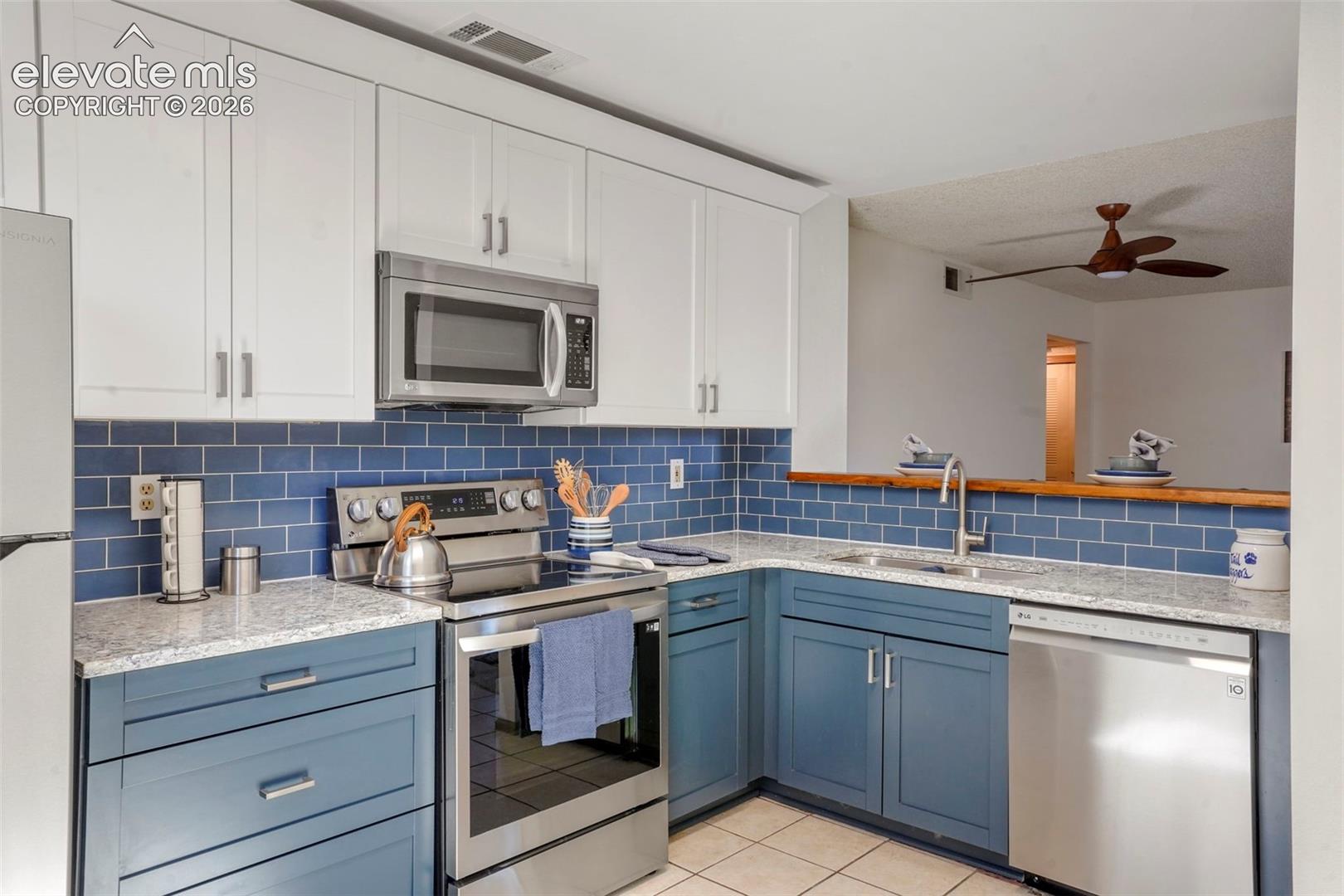 GRANITE, white cabinetry, blue cabinETRY