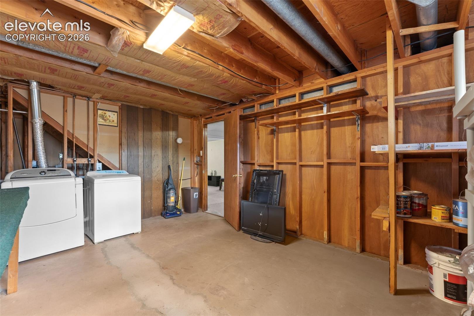 Concrete flooring and exposed wood ceiling joists