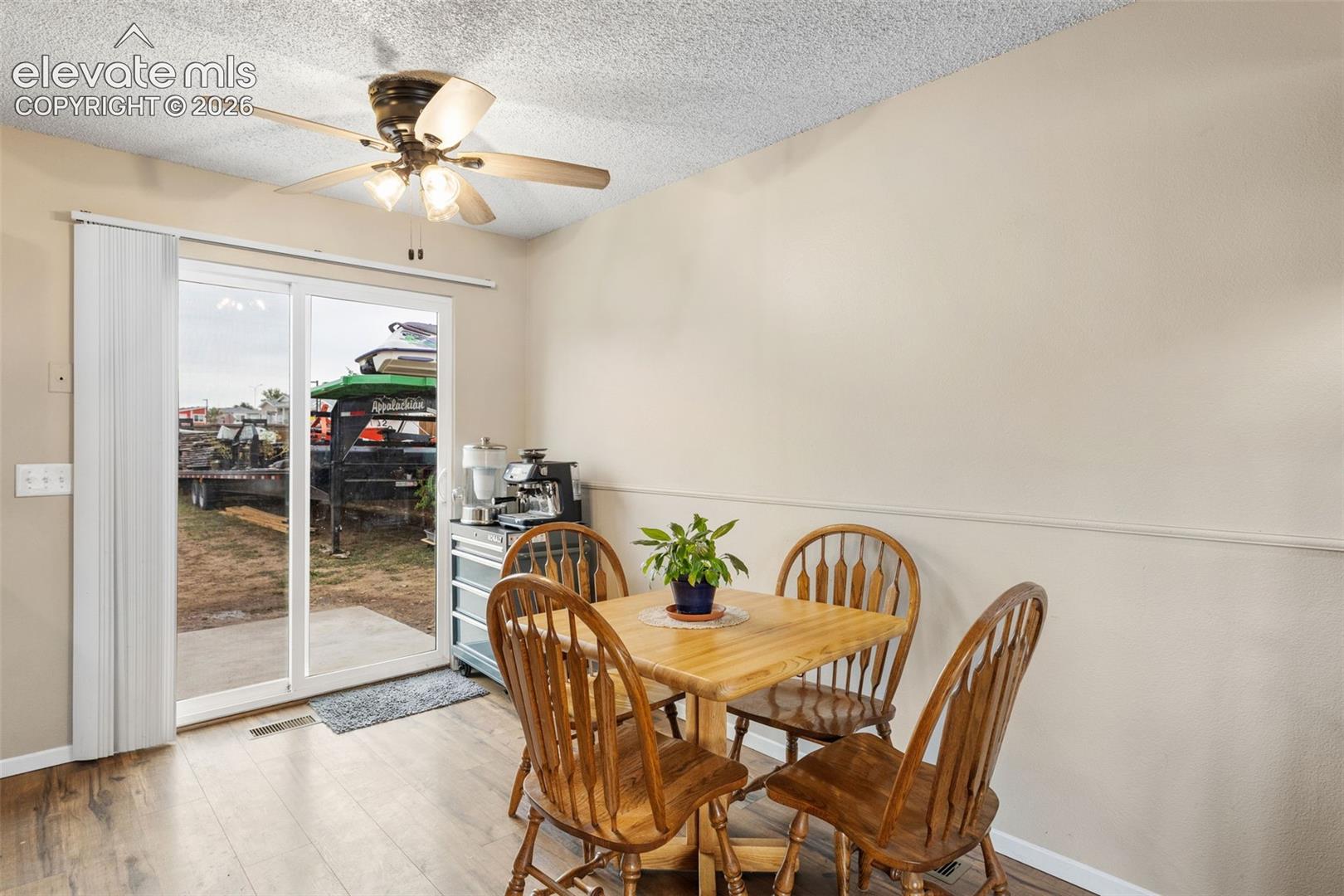 The kitchen and dining area walk-out to the expansive backyard