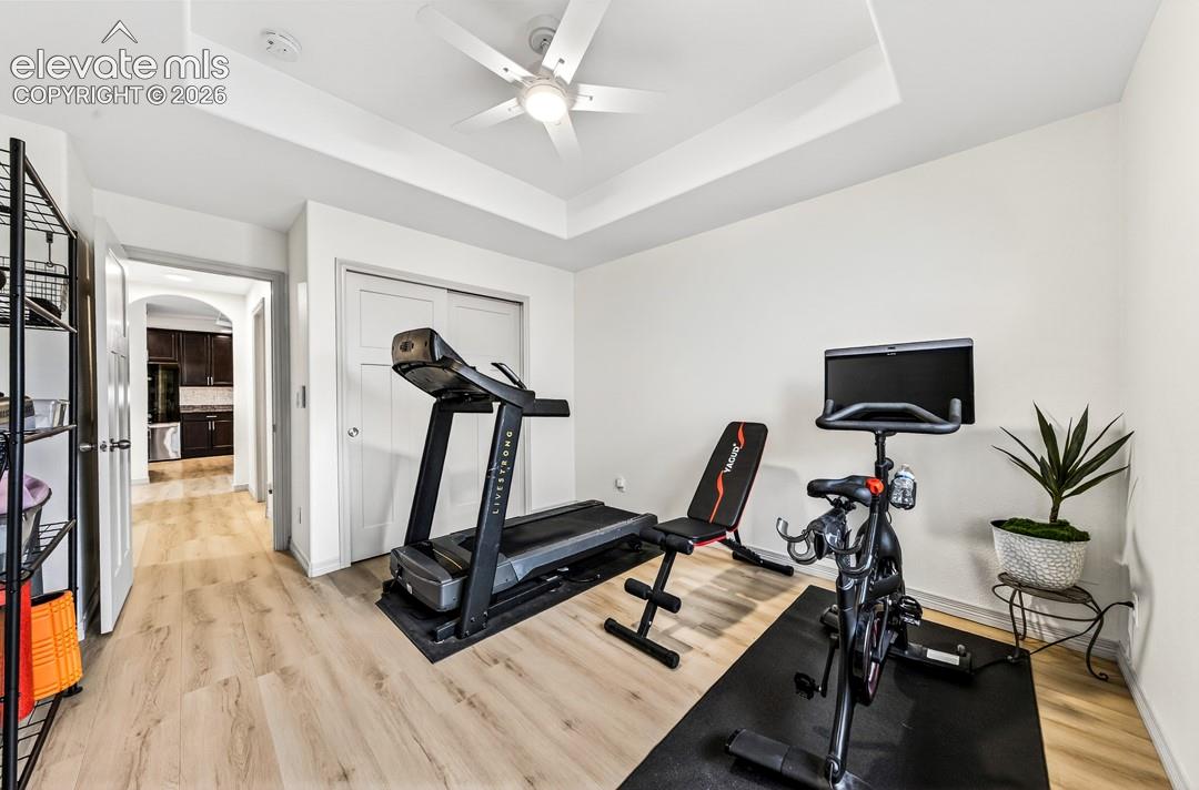 Main level, luxury vinyl, coffered ceiling, ceiling fan