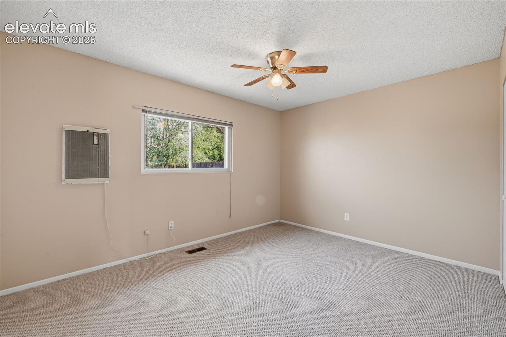 Neutral-toned walls with textured carpeting