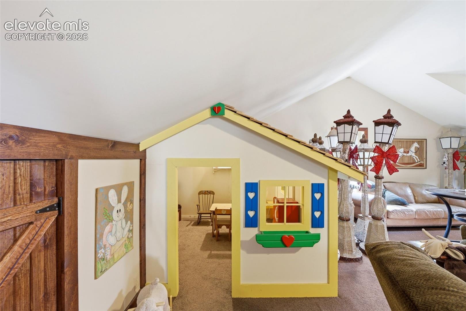 Built in play house in loft above garage
