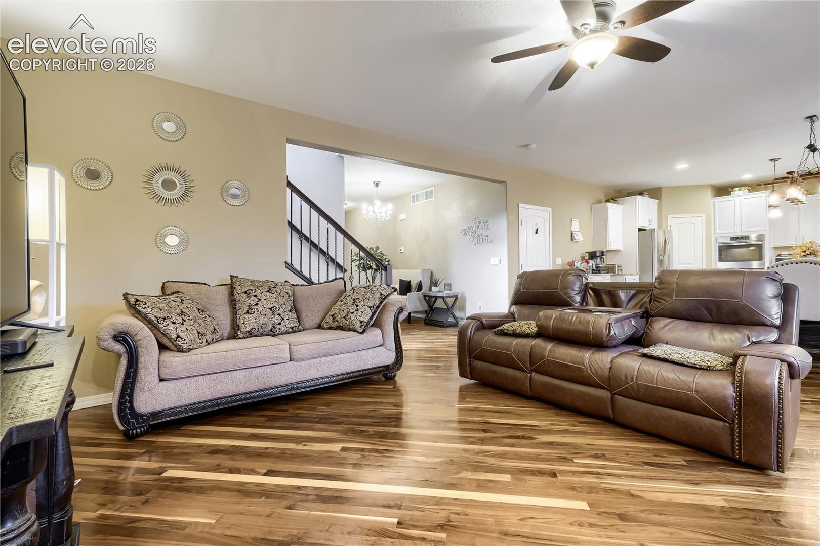 Spacious interior with wood flooring, perfect for entertaining